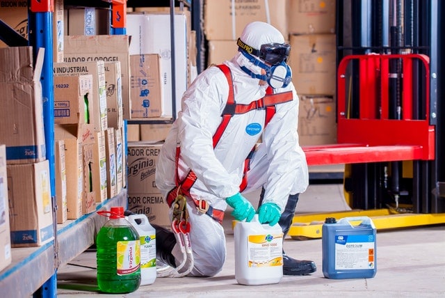 worker wearing proper protection when handling chemicals