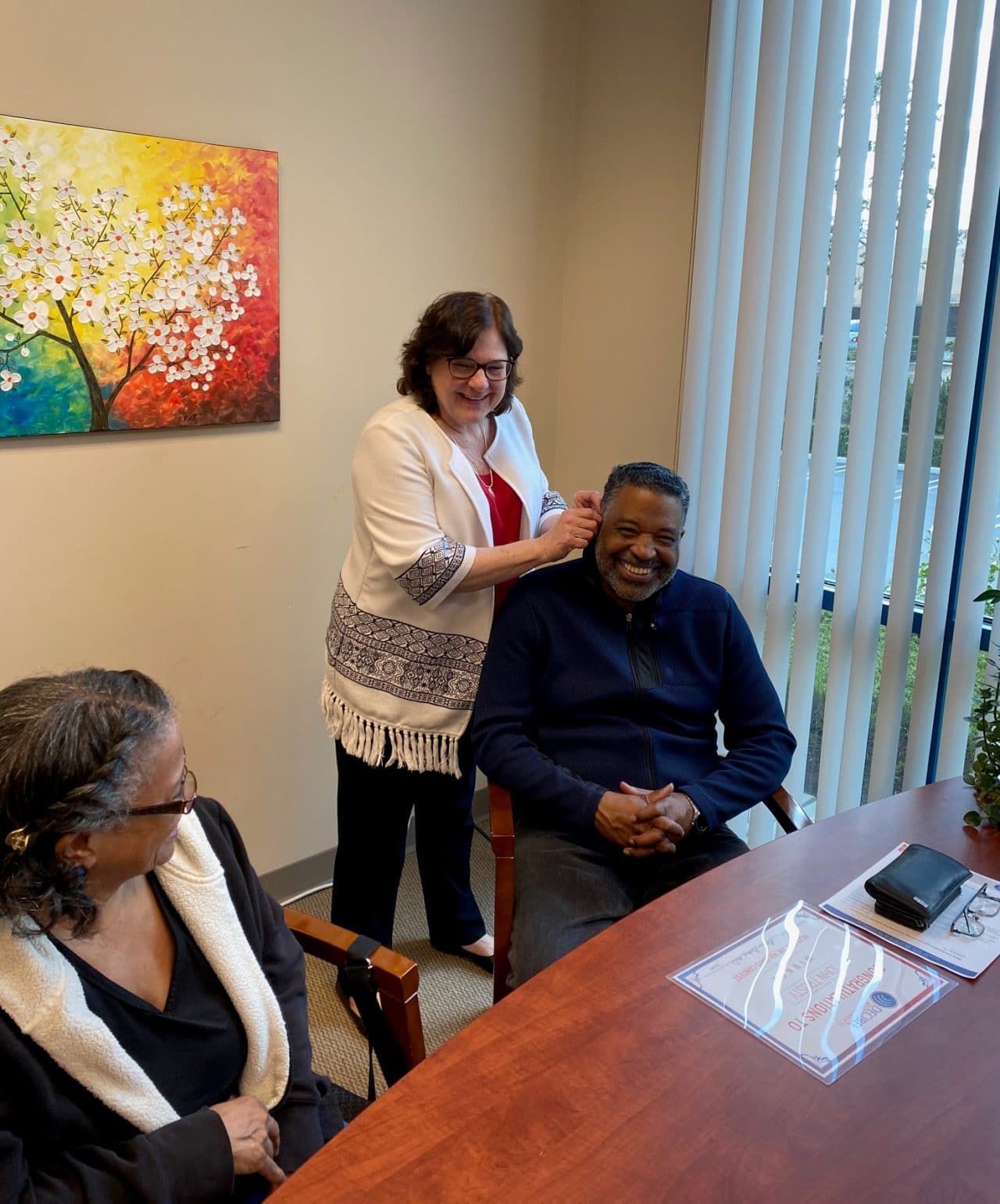 John being fitted for his hearing aid 