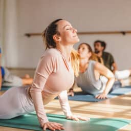 Happy woman in yoga class