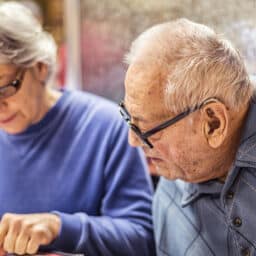 Man with hearing aids at restaurant